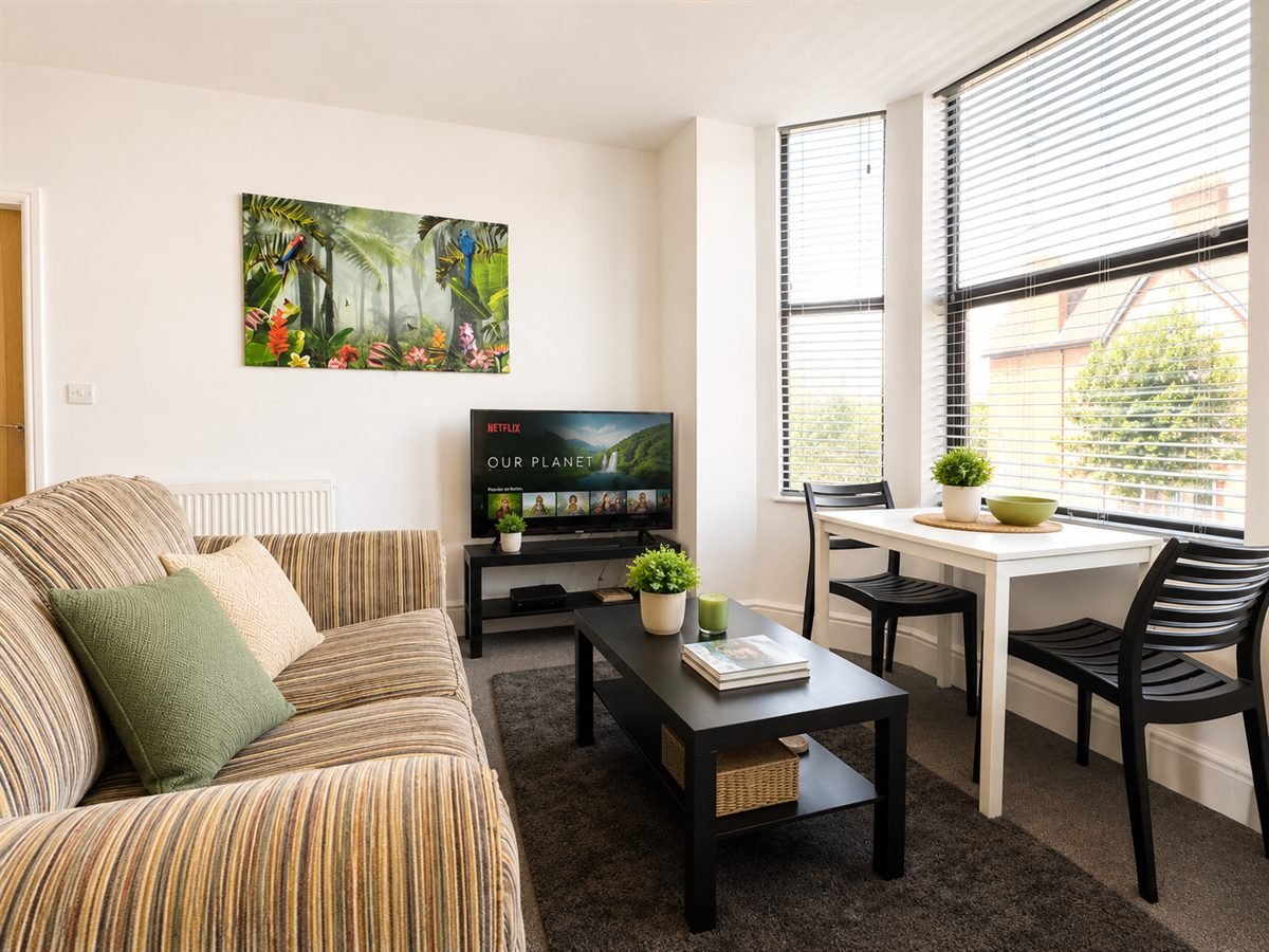 A furnished WB Lets living and dining room in Nottingham, with natural light from tall bay windows